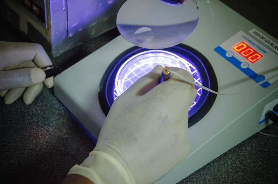 Technician testing water quality in the Cheers laboratory