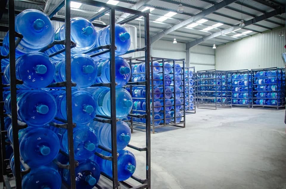 Rows of 20 litre bottles stored in the Cheers warehouse
